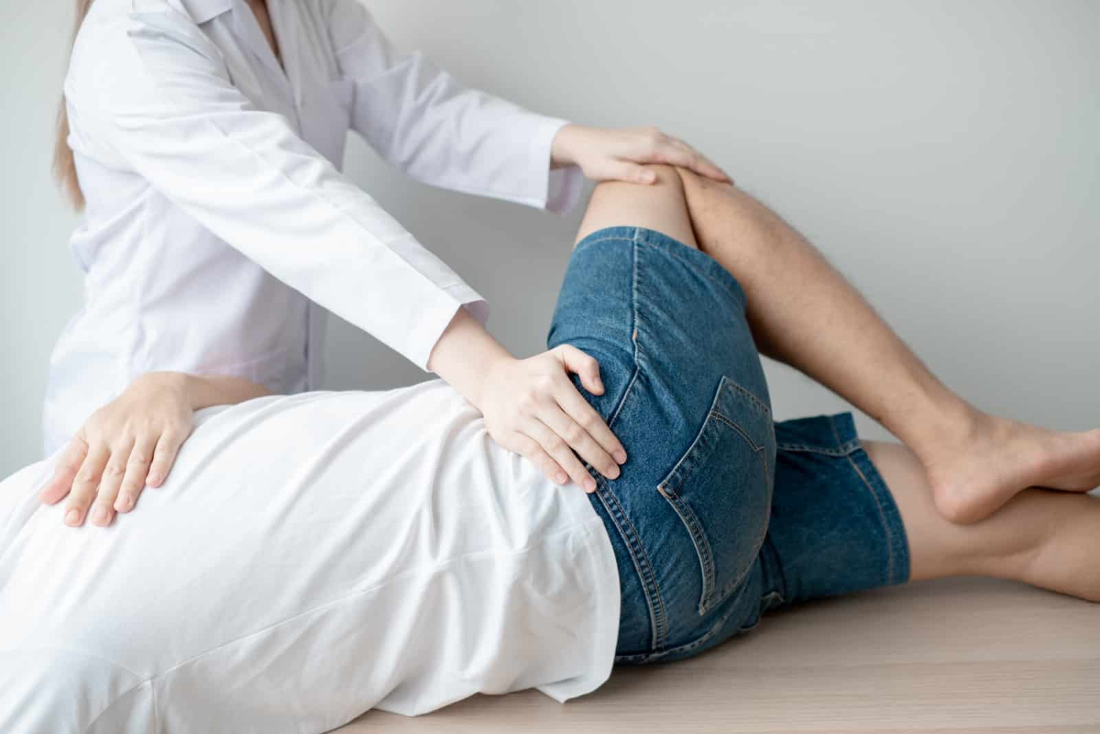 Patient receiving treatment for lower back & hip pain